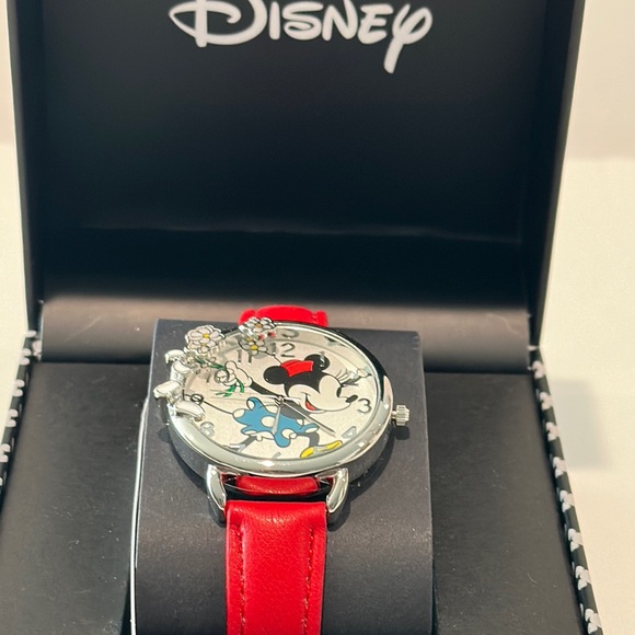 New in Box Disney’s Minnie Mouse Analog Watch with Silvertone Face and Red Band.